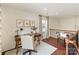 Upstairs loft area features a desk, a lounge chair, and natural light from a window at 4028 Woodsmill Rd, Fort Mill, SC 29707