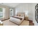 Main bedroom with hardwood floors, stylish accent wall, and natural light at 4028 Woodsmill Rd, Fort Mill, SC 29707