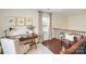 Upstairs office space featuring a wooden desk, artwork, and ample natural light at 4028 Woodsmill Rd, Fort Mill, SC 29707