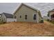 View of the home's backyard showing the newly installed siding at 407 Chambers St, Statesville, NC 28677