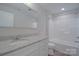 Fresh bathroom featuring a large mirror and a sink with granite countertops at 407 Chambers St, Statesville, NC 28677