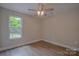 Cozy bedroom with ample natural light and a modern ceiling fan at 407 Chambers St, Statesville, NC 28677