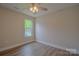 Bright bedroom with vinyl floors, natural light and a ceiling fan at 407 Chambers St, Statesville, NC 28677