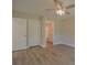 Bright bedroom with ceiling fan, two closets, and attached bathroom entrance at 407 Chambers St, Statesville, NC 28677