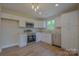 Kitchen featuring stainless steel appliances, granite countertops, and white cabinets at 407 Chambers St, Statesville, NC 28677