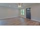 Living room with new laminate flooring, ceiling fan, recessed lighting, and a window view at 407 Chambers St, Statesville, NC 28677