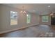 Living room showing many windows and laminate wood flooring at 407 Chambers St, Statesville, NC 28677