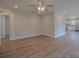 Open-concept living room featuring new floors leading into the kitchen at 407 Chambers St, Statesville, NC 28677