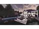 Backyard features an inground pool with a jacuzzi and outdoor lounging area at 434 Breezewood Dr, Belmont, NC 28012