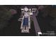 Aerial view of a luxurious pool featuring a jacuzzi, fire pit, and manicured backyard at 434 Breezewood Dr, Belmont, NC 28012