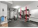 Basement gym featuring weightlifting equipment, black mats, and mirrored walls at 434 Breezewood Dr, Belmont, NC 28012