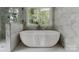 Bright bathroom features a sleek, modern soaking tub by a picture window at 434 Breezewood Dr, Belmont, NC 28012
