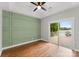 Bright bedroom with a decorative wall and a sliding door leading to a private balcony at 434 Breezewood Dr, Belmont, NC 28012