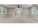 Spacious bonus room with neutral walls, carpet, and dormer ceiling featuring a built-in window at 434 Breezewood Dr, Belmont, NC 28012
