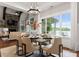Bright dining area with glass table set for entertaining, and views of the lake at 434 Breezewood Dr, Belmont, NC 28012