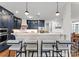 Modern kitchen island with seating, pendant lights, and stainless steel appliances at 434 Breezewood Dr, Belmont, NC 28012