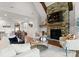 Spacious living room features a stone fireplace, hardwood floors, and abundant natural light at 434 Breezewood Dr, Belmont, NC 28012