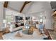 Open-concept living room flows into kitchen and dining areas with high ceilings and neutral tones at 434 Breezewood Dr, Belmont, NC 28012