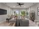 Open living room features comfortable seating and access to the beautiful outdoors at 434 Breezewood Dr, Belmont, NC 28012