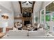 Inviting living room features a stone fireplace, vaulted ceiling with beams, and stylish neutral decor at 434 Breezewood Dr, Belmont, NC 28012
