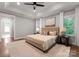 Spacious bedroom with neutral tones, plush carpet, and beautiful natural light at 434 Breezewood Dr, Belmont, NC 28012