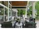 Outdoor living space with comfortable seating and a view of the surrounding trees at 434 Breezewood Dr, Belmont, NC 28012