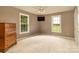 Empty bedroom with neutral carpet, natural light, and empty walls at 4470 W Bandys Cross Rd, Claremont, NC 28610