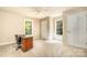 Empty bedroom with neutral carpet, two windows, and closet at 4470 W Bandys Cross Rd, Claremont, NC 28610