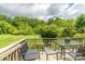 Outdoor deck with patio furniture, perfect for enjoying the landscaped backyard and wooded views at 4470 W Bandys Cross Rd, Claremont, NC 28610