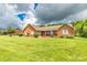 Charming brick home featuring a well-manicured lawn and inviting front porch at 4470 W Bandys Cross Rd, Claremont, NC 28610