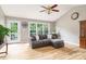 Comfortable living room with vaulted ceilings, wood floors, and backyard views at 4470 W Bandys Cross Rd, Claremont, NC 28610