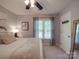Comfortable bedroom featuring a large bed, neutral decor, and natural light from the window at 5900 Colwick Nw Ct, Concord, NC 28027