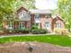 Traditional brick home with a well-manicured lawn and charming curb appeal at 5900 Colwick Nw Ct, Concord, NC 28027