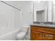 Bathroom featuring a tub and shower combination with a granite vanity at 6033 Bountiful St # 201, Belmont, NC 28012