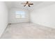 Neutral bedroom with vaulted ceilings, a ceiling fan, and a window allowing natural light at 6033 Bountiful St # 201, Belmont, NC 28012