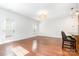 Bright living room featuring hardwood floors, neutral walls and direct access to the patio at 6033 Bountiful St # 201, Belmont, NC 28012