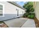 Relaxing outdoor patio area with a white door, small garden, and serene backyard ambiance at 6033 Bountiful St # 201, Belmont, NC 28012