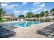 Community swimming pool with lounge chairs, pergolas, and a kiddie pool, perfect for relaxation and recreation at 6033 Bountiful St # 201, Belmont, NC 28012