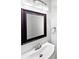 Bathroom featuring updated vanity, framed mirror, and modern fixtures, offering a clean and stylish design at 6121 Dane Dr, Dallas, NC 28034