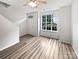 Bright living room with light wood floors, neutral walls, and large window, creating a fresh and modern space at 6121 Dane Dr, Dallas, NC 28034