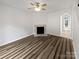Bright living room with fireplace, wood floors, and neutral tones, creating a calm and inviting atmosphere at 6121 Dane Dr, Dallas, NC 28034