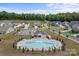 Community pool with lounge chairs and neighborhood homes in a well-kept North Carolina neighborhood at 7604 Tanglewood Way, Denver, NC 28037