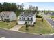 An aerial view of a lovely two-story home featuring a large front yard and two-car garage at 7604 Tanglewood Way, Denver, NC 28037