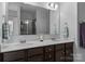 Bathroom with double vanity, a large mirror, and stylish lighting at 7604 Tanglewood Way, Denver, NC 28037