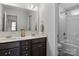 This bathroom has a double sink vanity and tub/shower combination at 7604 Tanglewood Way, Denver, NC 28037