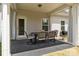 Covered patio with outdoor seating and grill at 7604 Tanglewood Way, Denver, NC 28037