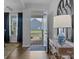 Inviting entryway with hardwood floors, stylish console table, and a view of the home's exterior at 7604 Tanglewood Way, Denver, NC 28037