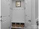 Mudroom with bench, storage, and hooks for coats at 7604 Tanglewood Way, Denver, NC 28037