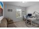 Office with a modern desk, comfortable seating, and natural light at 7604 Tanglewood Way, Denver, NC 28037