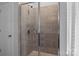 Bathroom shower features modern tile work, and a glass door at 7604 Tanglewood Way, Denver, NC 28037
